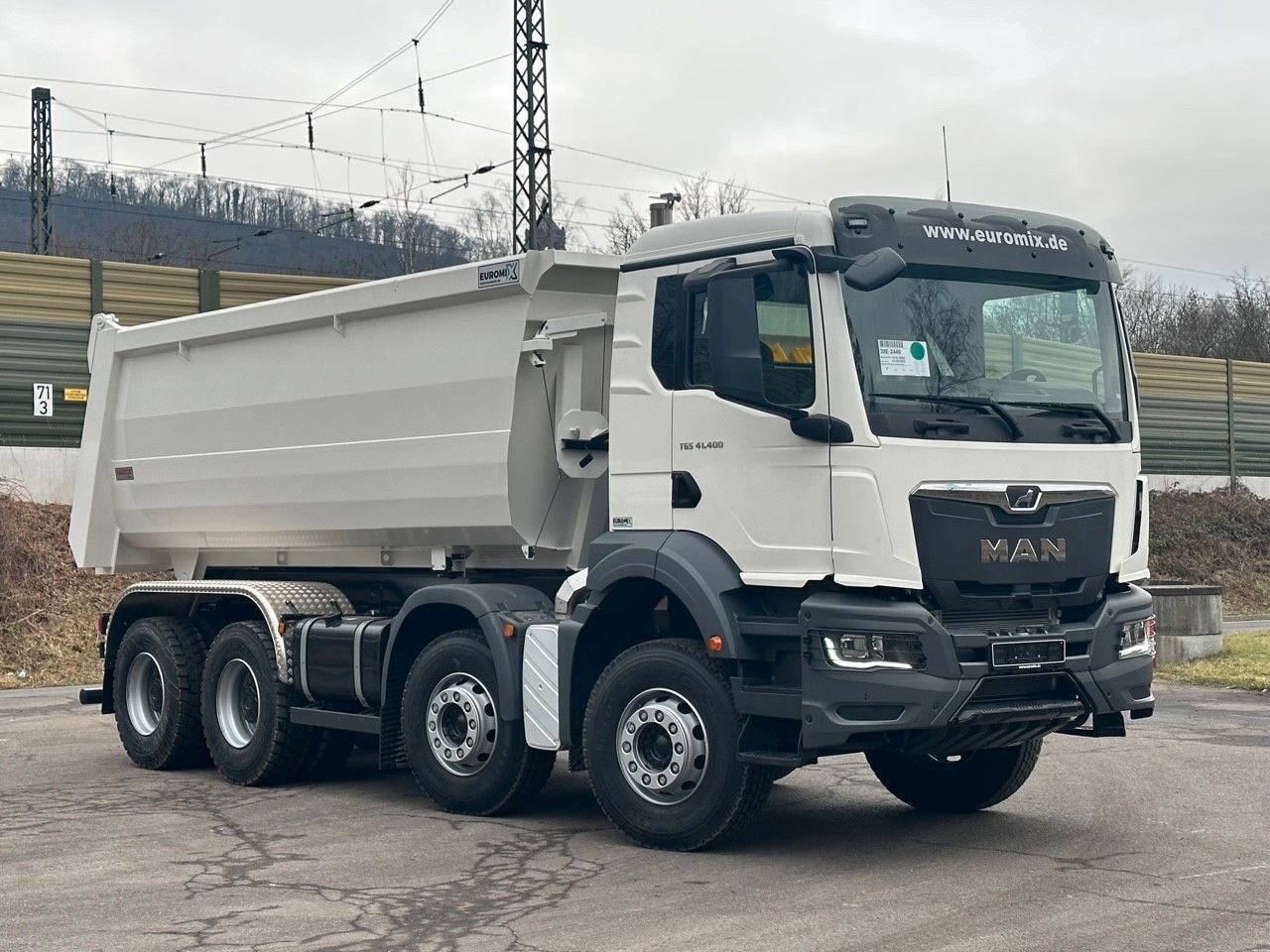 MAN TGS 41.400 8x4 / EUROMIX MTP 20m³/ EURO 5 - Skip loader truck: picture 1 MAN TGS 41.400 8x4 / EUROMIX MTP 20m³/ EURO 5 - Skip loader truck: picture 1