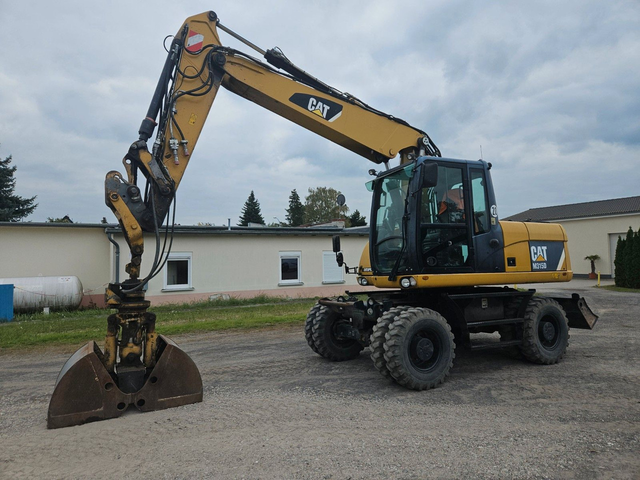 CAT M315D orig. 4.129h - Wheel excavator: picture 1 CAT M315D orig. 4.129h - Wheel excavator: picture 1