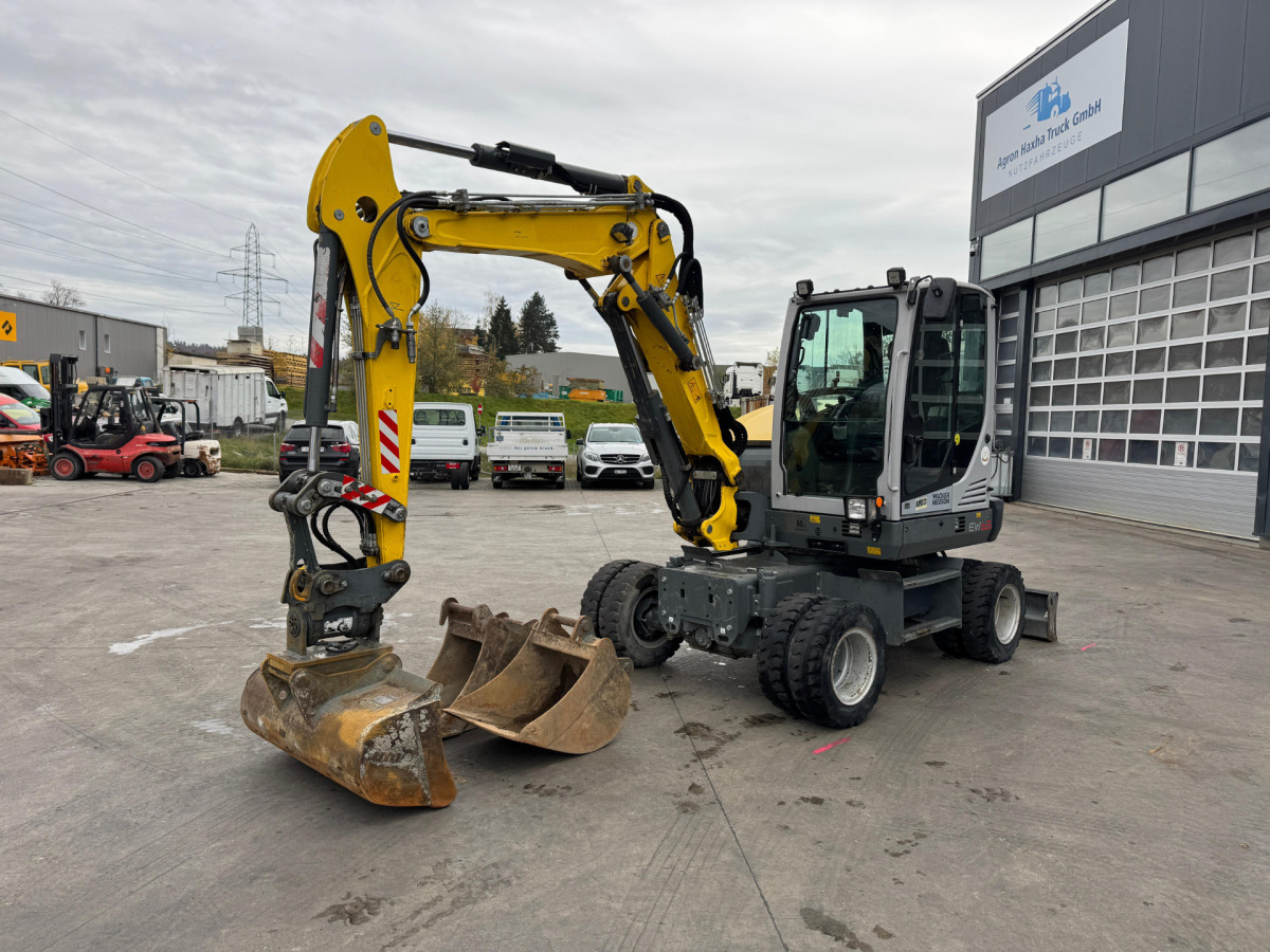 NEUSON EW65 E14-2 Powertilt 3x Schaufeln - Wheel excavator: picture 1 NEUSON EW65 E14-2 Powertilt 3x Schaufeln - Wheel excavator: picture 1
