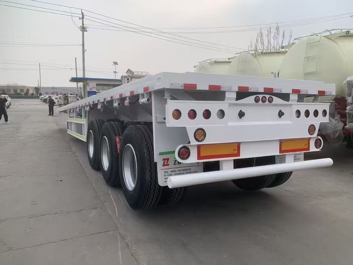 Low loader semi-trailer ZHICHENG Semni Flat Bed Low Bed Floater with 3 Axles 4 Axles New or Used 12M 13.75M In High Quality: picture 23 Low loader semi-trailer ZHICHENG Semni Flat Bed Low Bed Floater with 3 Axles 4 Axles New or Used 12M 13.75M In High Quality: picture 23