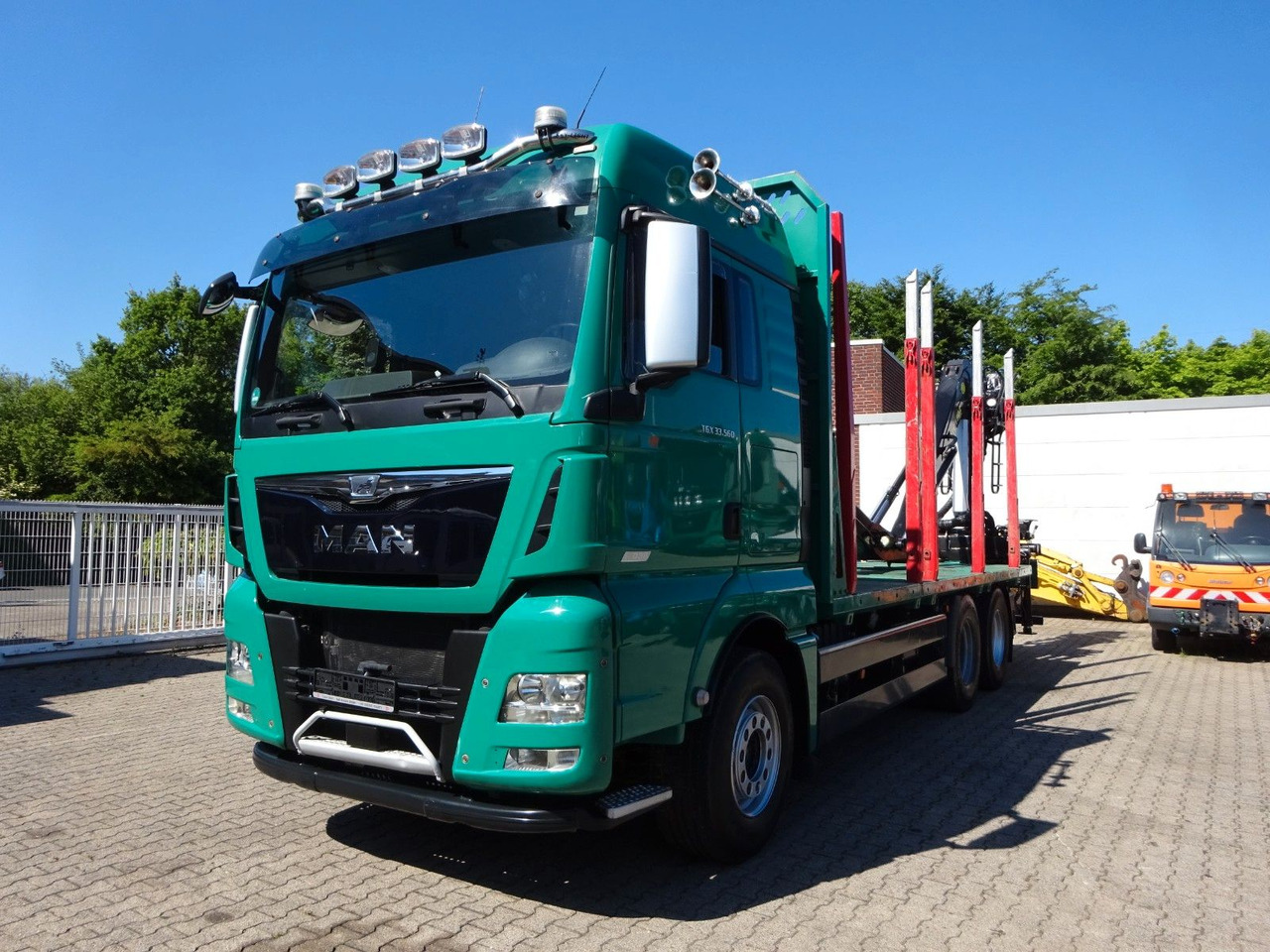 MAN 33.560 TGX mit TAJFUN L150Z Holzladekran 6x4 - Timber truck, Crane truck: picture 1 MAN 33.560 TGX mit TAJFUN L150Z Holzladekran 6x4 - Timber truck, Crane truck: picture 1