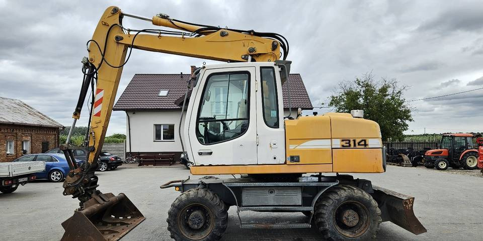 Koparka kołowa Liebherr A314 Litronic 9350 h 4 łyżki kołówka - Wheel excavator: picture 1 Koparka kołowa Liebherr A314 Litronic 9350 h 4 łyżki kołówka - Wheel excavator: picture 1