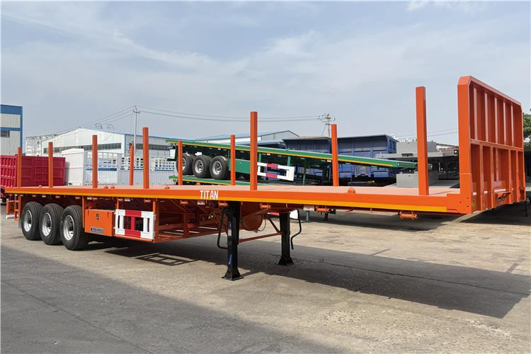 TITAN Container Flatbed Truck Trailer with Piles In Angola - Container transporter/ Swap body semi-trailer: picture 1 TITAN Container Flatbed Truck Trailer with Piles In Angola - Container transporter/ Swap body semi-trailer: picture 1