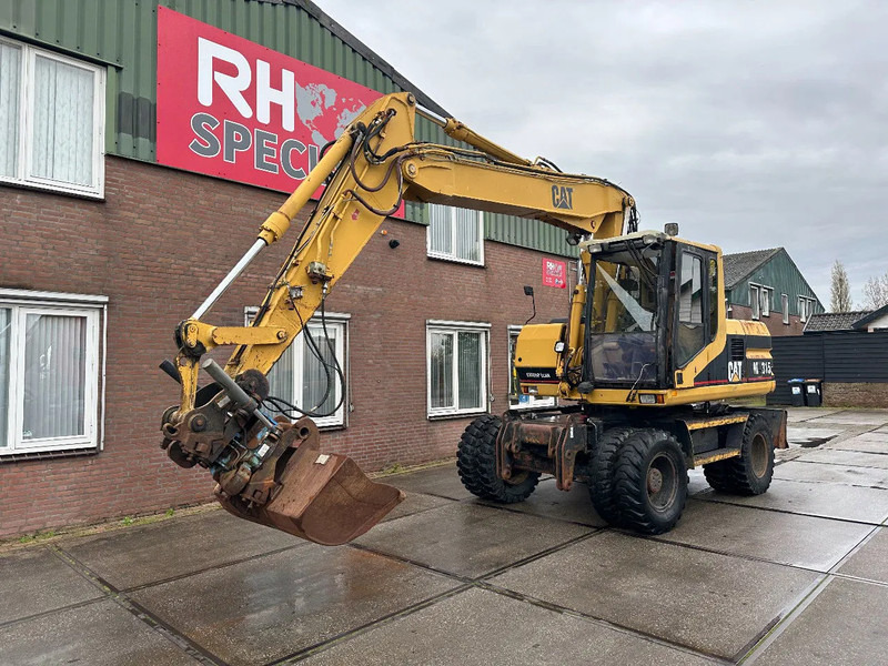 Caterpillar M315 +ROTO CE - Wheel excavator: picture 2 Caterpillar M315 +ROTO CE - Wheel excavator: picture 2